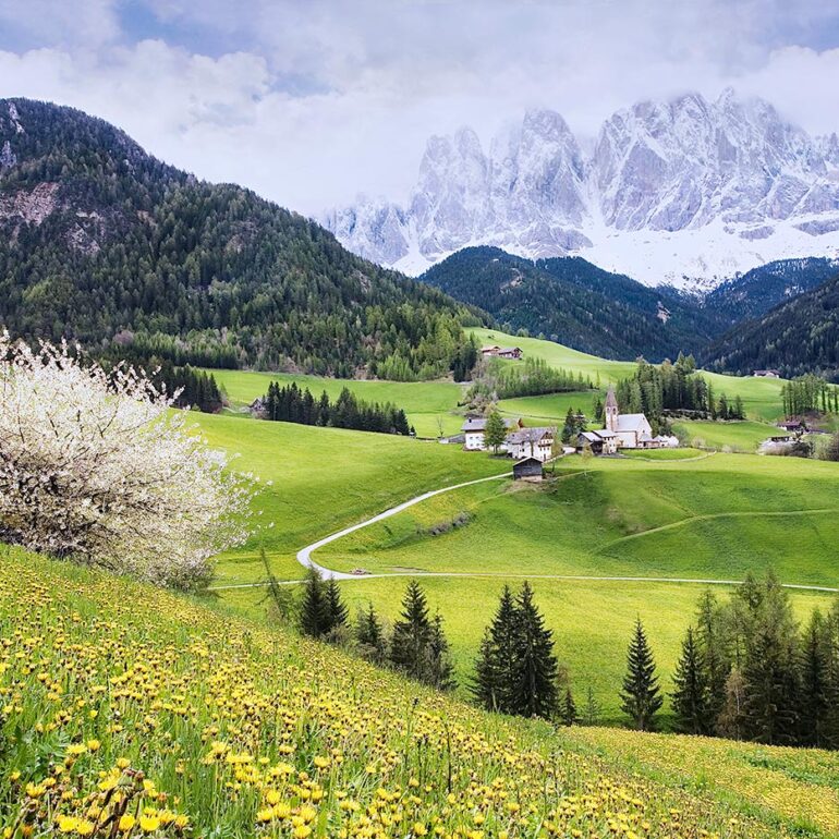 Beautiful chuch set in a mountain backdrop.