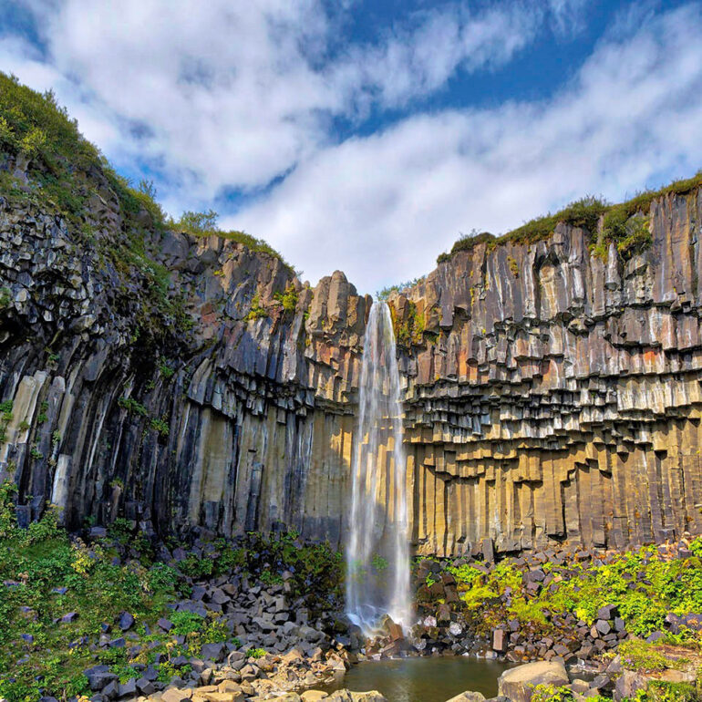 Basalt columns with a waterfall.