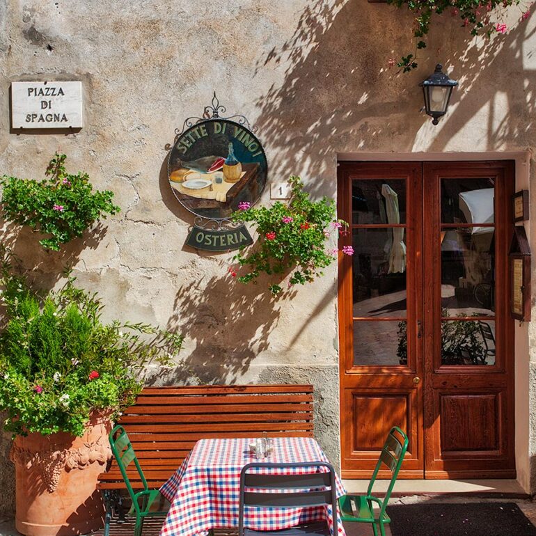 Small table set outside a restaurant.