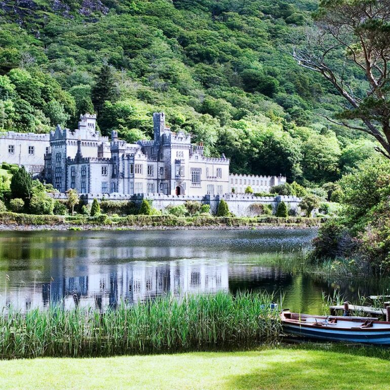Castle on a lake with boats.