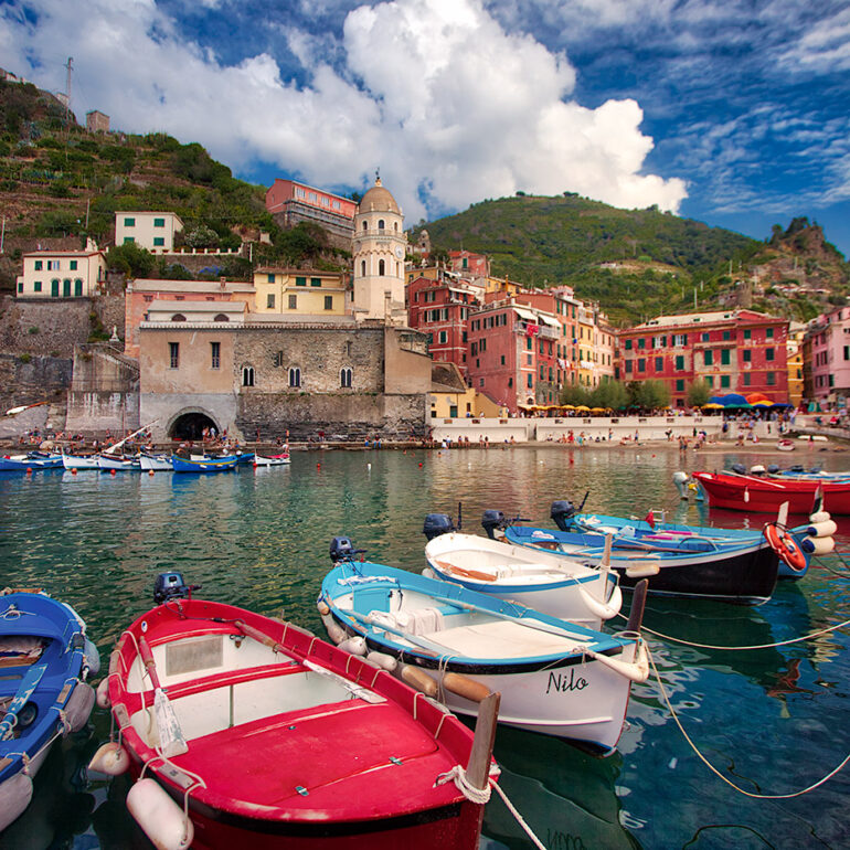 A row of colorful boats in the beautiful harbor of Vernazza.