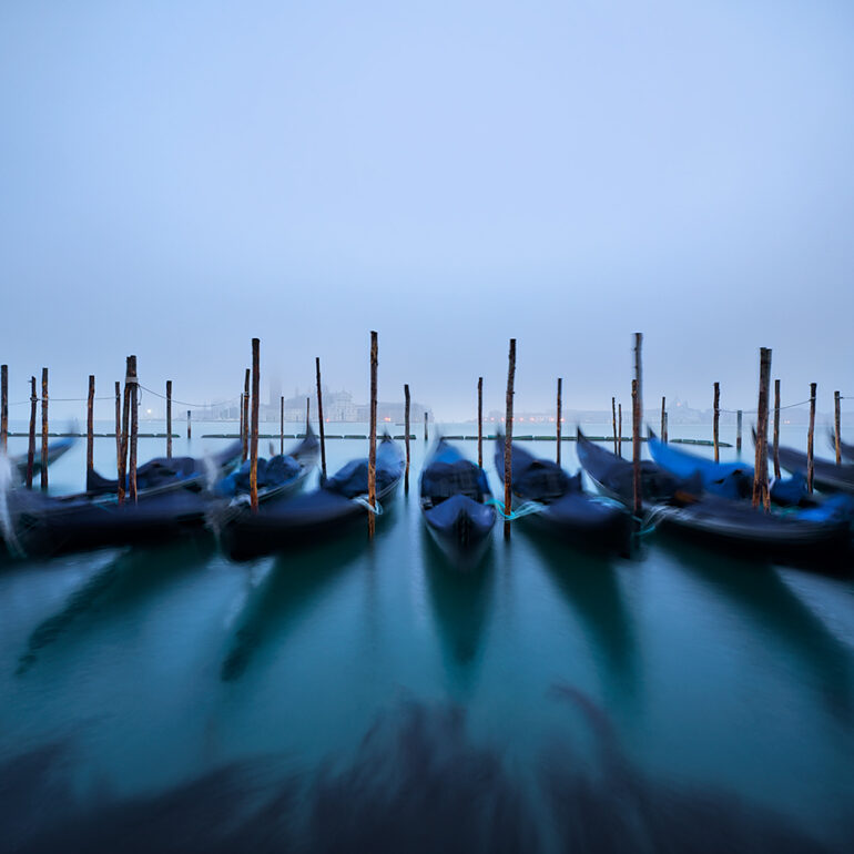 Mist shrouded gondolas in the early morning.