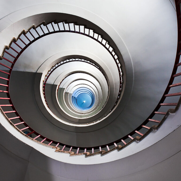 Spiral staircase going up in the first skyscraper in Ljubljana.